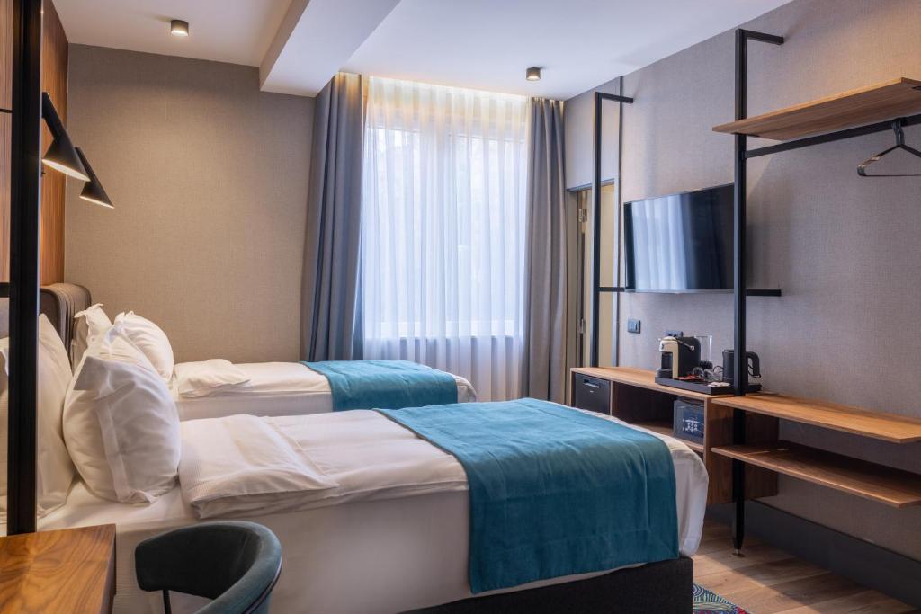 Postel nebo postele na pokoji v ubytování Hotel Square by MARGO