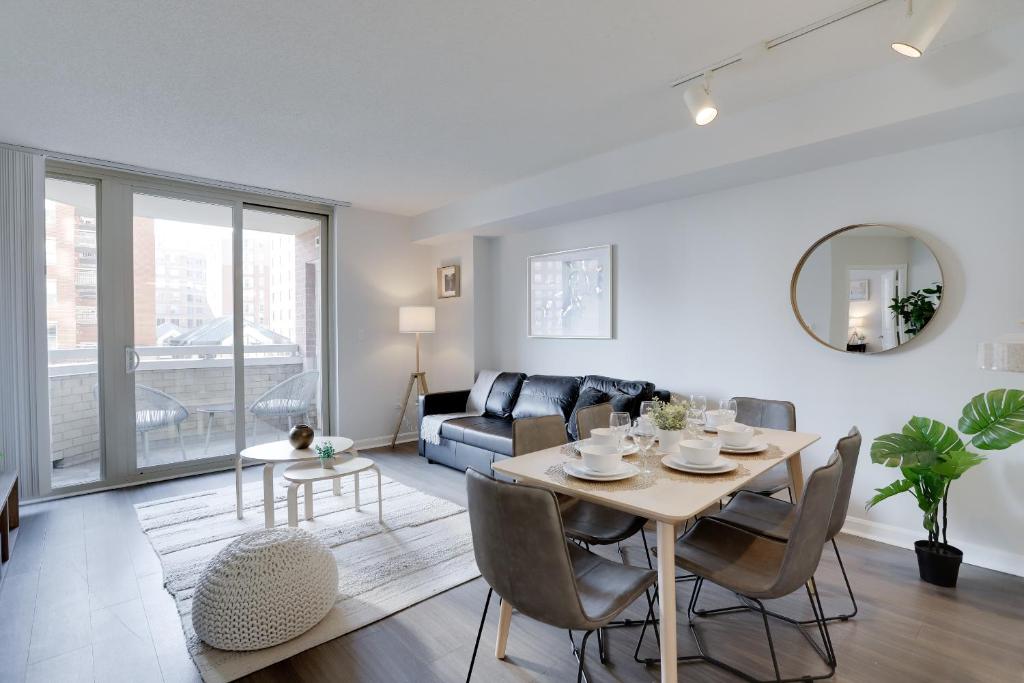 a living room with a table and a couch at Apartment Just Steps from Ballston Subway Station in Arlington