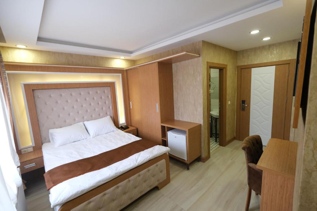 Postel nebo postele na pokoji v ubytování MİSSWAK HOTEL SORGUN