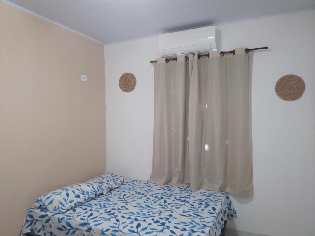 Ein Bett oder Betten in einem Zimmer der Unterkunft Casa Lari milagres