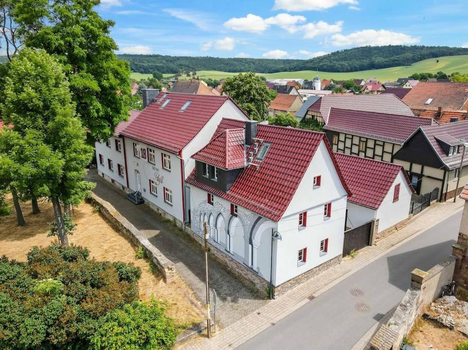 an aerial view of a town with white buildings at Landhaus Kaiserpfalz #2 bis 10P in Memleben