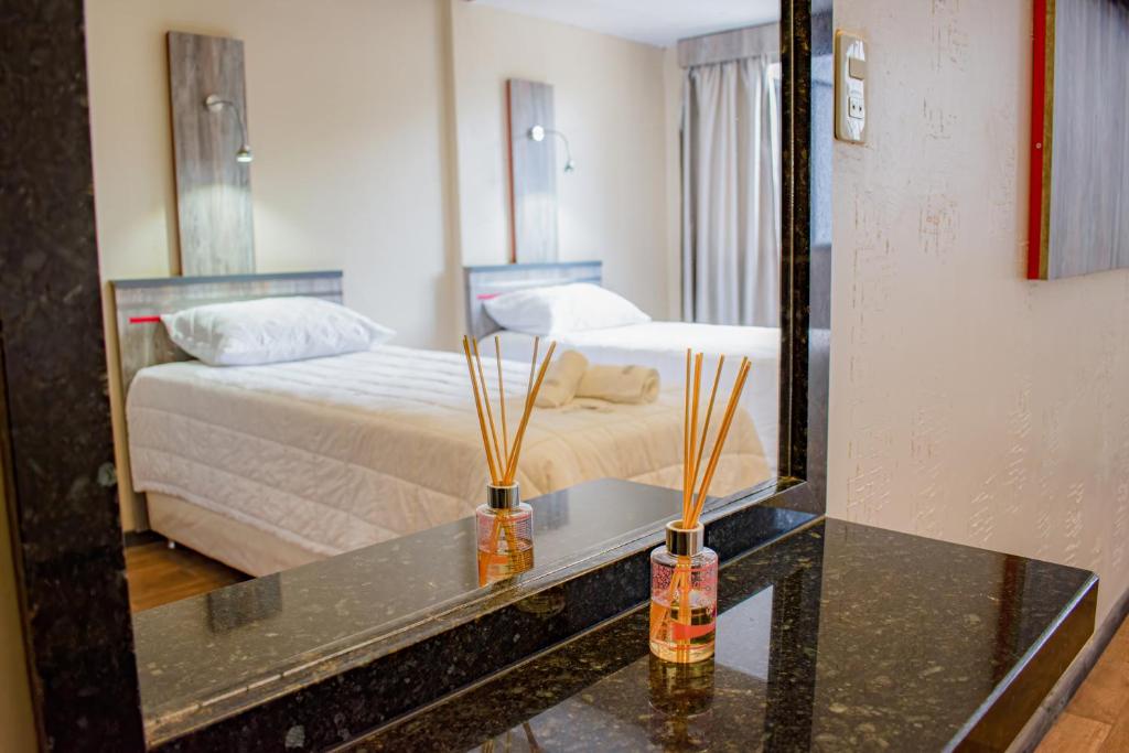 Postel nebo postele na pokoji v ubytování Hotel Rio Dorado