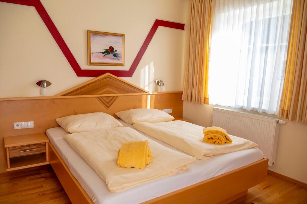Postel nebo postele na pokoji v ubytování Sonnblick am Wörthersee