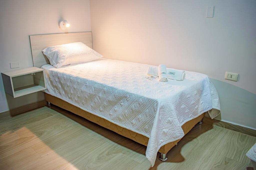 Postel nebo postele na pokoji v ubytování Hotel Rio Dorado