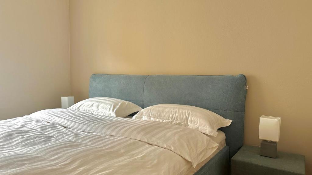 Postel nebo postele na pokoji v ubytování City Apartment Sankt Pölten