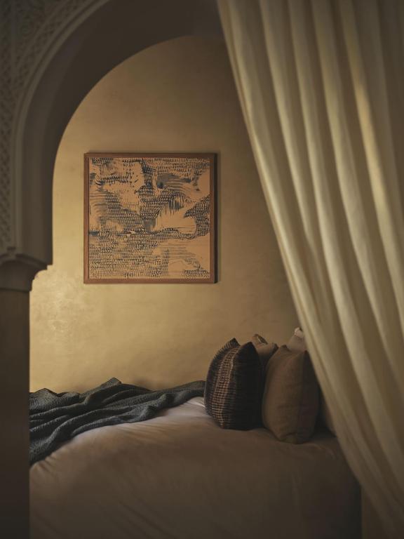 Postel nebo postele na pokoji v ubytování IZZA Marrakech