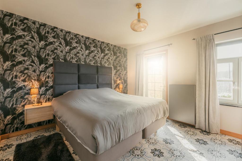 Postel nebo postele na pokoji v ubytování Kokerelle vakantiewoningen