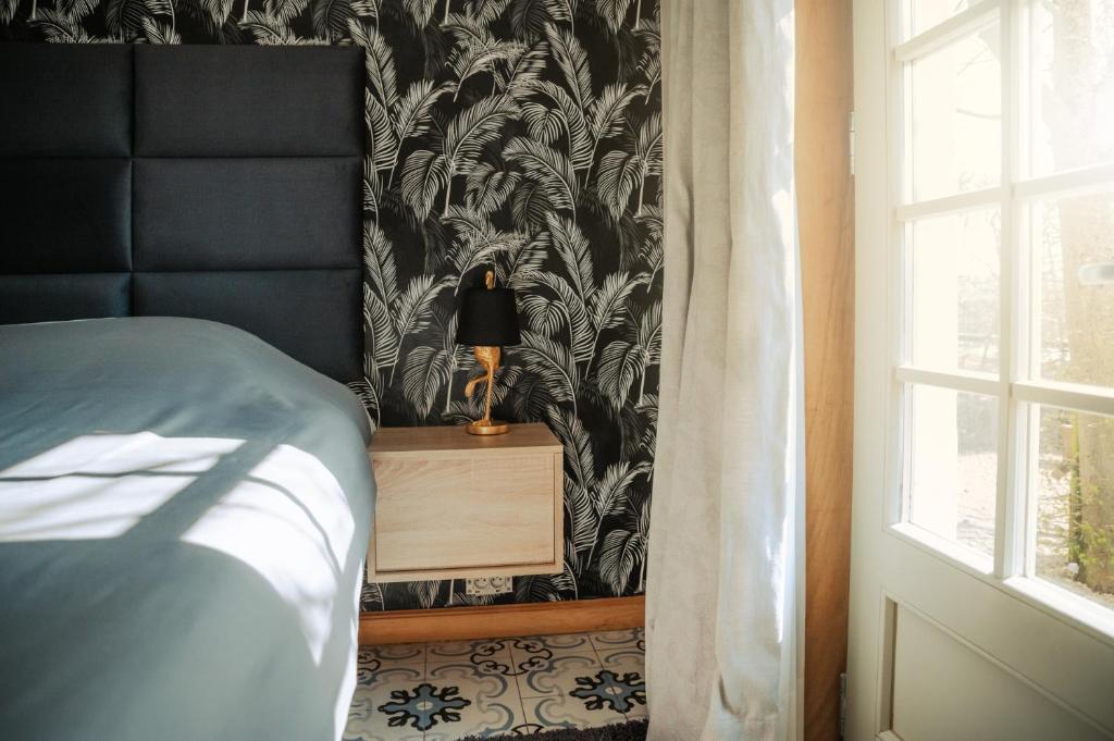 Postel nebo postele na pokoji v ubytování Kokerelle vakantiewoningen