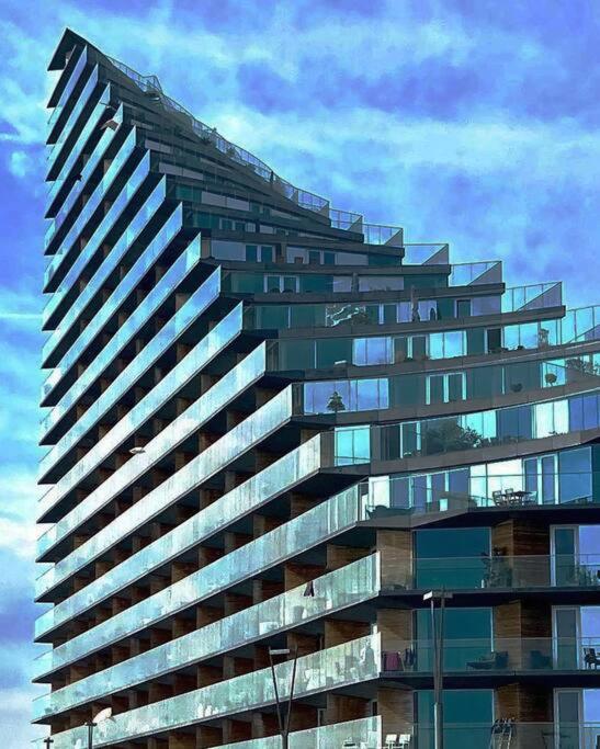 a tall glass building with a lot of windows at AArhus 115 in Aarhus