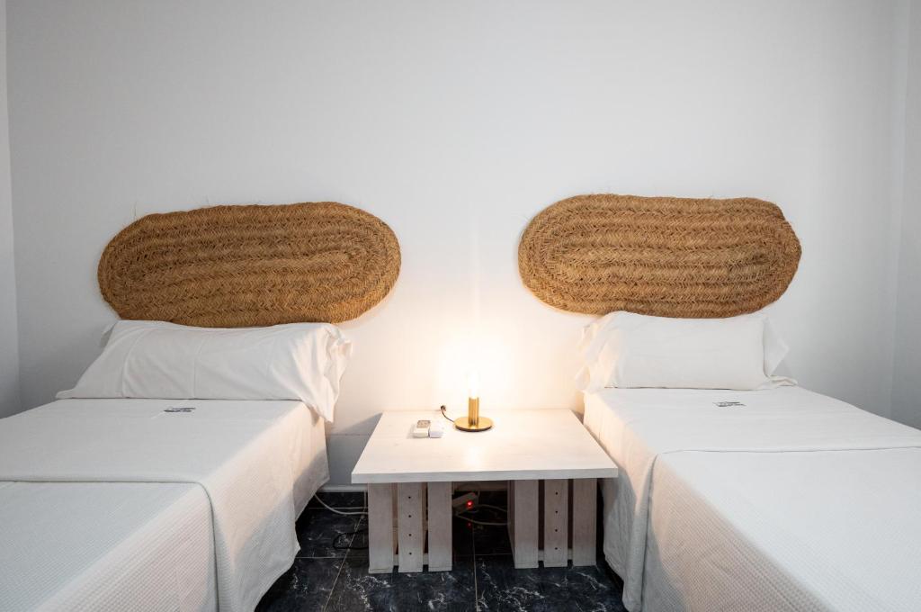 Postel nebo postele na pokoji v ubytování CASA VELA BLANCA