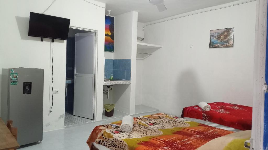 Postel nebo postele na pokoji v ubytování Blue Hotel
