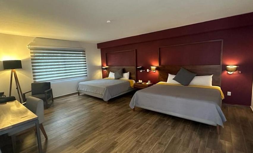 Postel nebo postele na pokoji v ubytování Hotel Boutique Abad