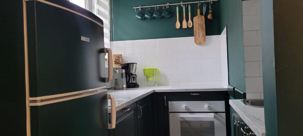 Kuchyňa alebo kuchynka v ubytovaní Apartament Zielona Przystań Gdańsk