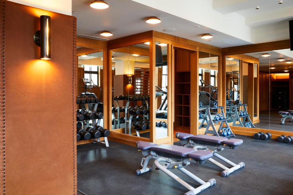 a gym with several treadmills and mirrors at Shinola Hotel in Detroit