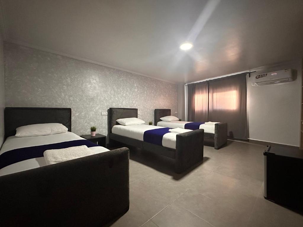 Postel nebo postele na pokoji v ubytování Hotel Cataleya Al-Hoceima