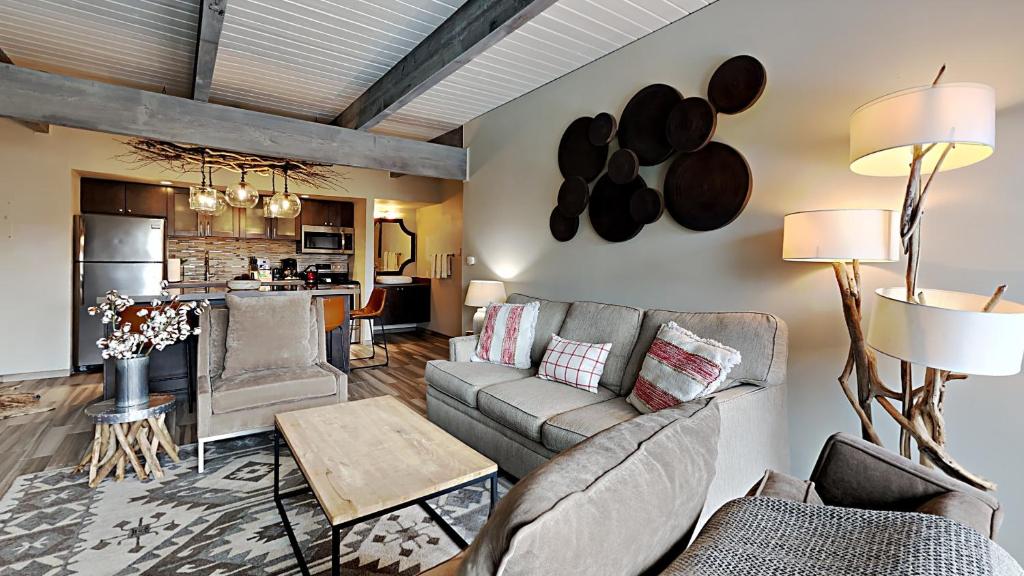 a living room with a couch and a table at Timberline Condominiums 1 Bedroom Premier Unit D2B in Snowmass Village