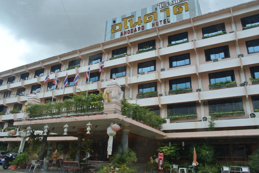 a hotel with a sign on the front of it at Anodard Hotel Chiang Mai in Chiang Mai