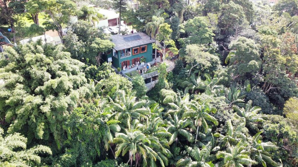 a house in the middle of a forest of trees at Sparadise a natureza em harmonia com tecnologia in São Paulo