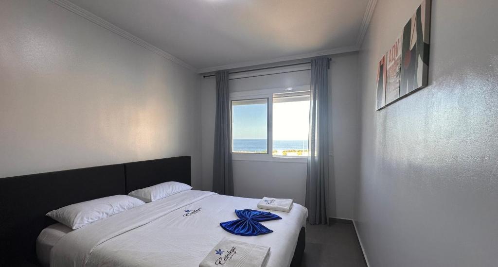 Postel nebo postele na pokoji v ubytování Hotel Cataleya Al-Hoceima