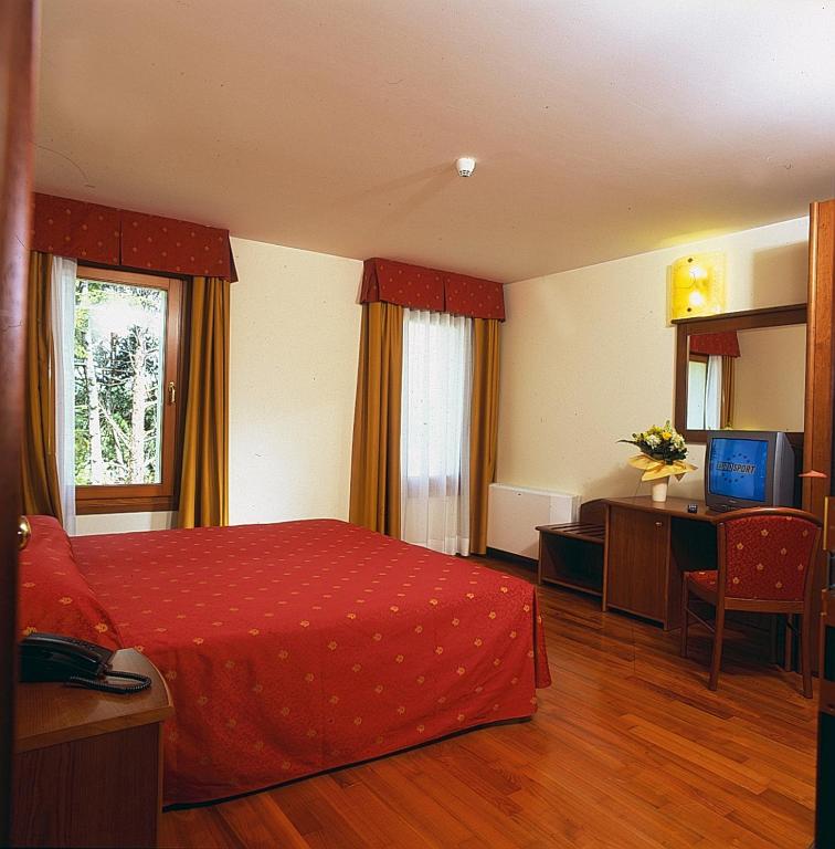 Postel nebo postele na pokoji v ubytování Hotel Dall'Ongaro