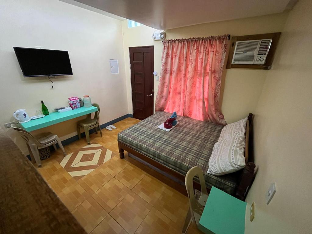 Postel nebo postele na pokoji v ubytování Marian's Transient House