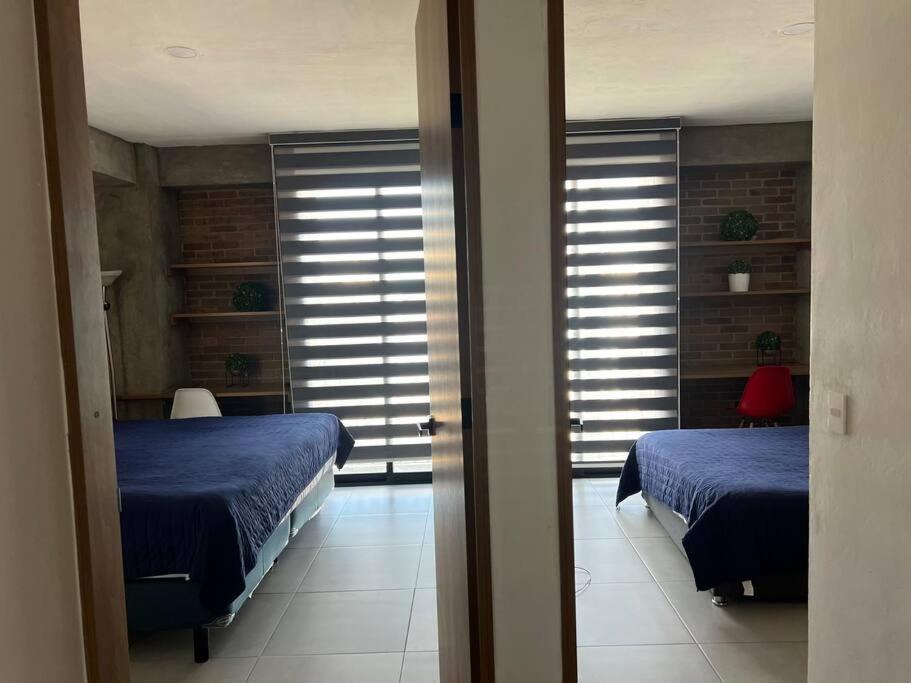 Postel nebo postele na pokoji v ubytování Departamento centrico
