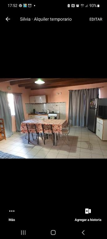 a view of a kitchen with a table in a room at Departamento barrio Loma in Comodoro Rivadavia