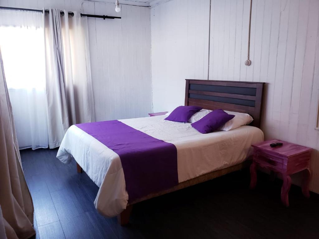 Cama o camas de una habitación en Hostal Arrayan