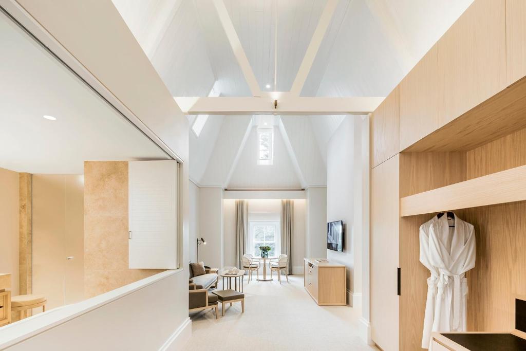 a living room with white walls and a ceiling at COMO The Treasury in Perth