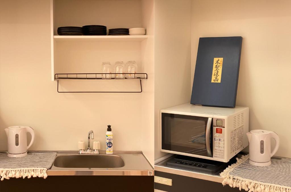Kuchyň nebo kuchyňský kout v ubytování Mitomi Home 4F