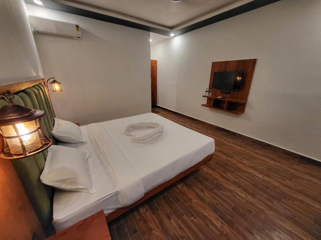 Postel nebo postele na pokoji v ubytování Rashiva Resort