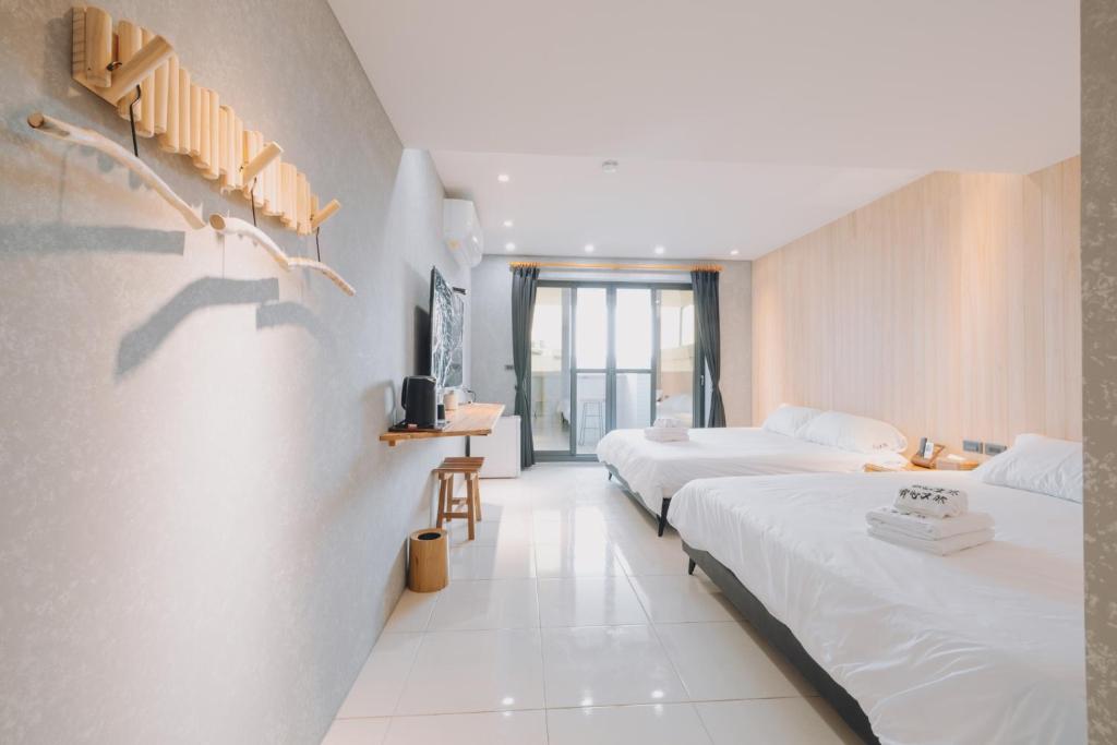 Rúm í herbergi á 宥心文旅You Sin B&B