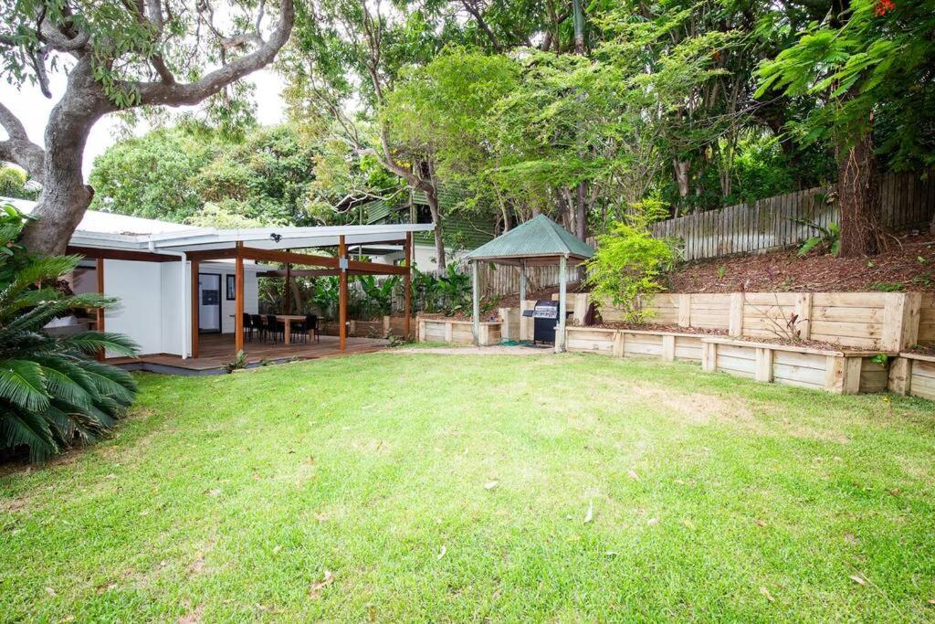 a backyard with a gazebo and a fence at Island Hideaway + 1 min to Cylinder Beach + Sleeps 10 in Point Lookout