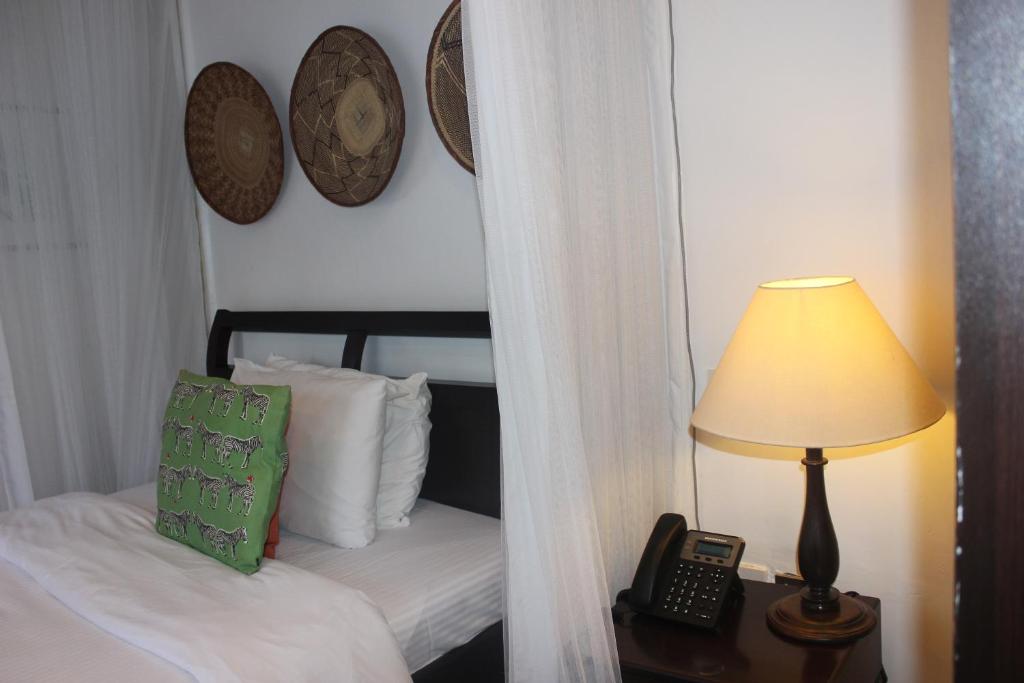 Postel nebo postele na pokoji v ubytování Seo Hotel