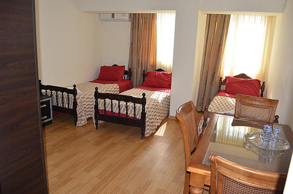Postel nebo postele na pokoji v ubytování Hotel Okriba