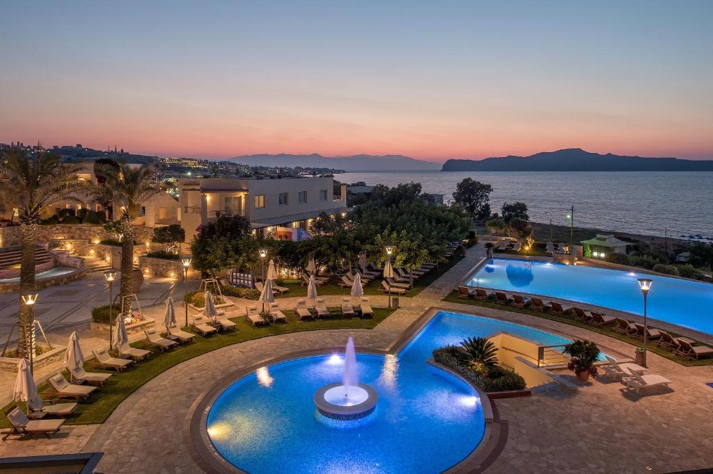 an aerial view of a resort with a pool at Cretan Dream Resort & Spa in Stalos