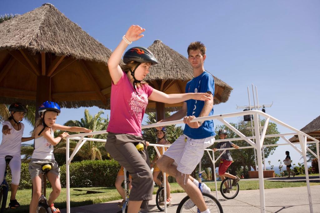 a group of people riding bikes at a resort at ROBINSON ESQUINZO PLAYA - All Inclusive in Morro del Jable