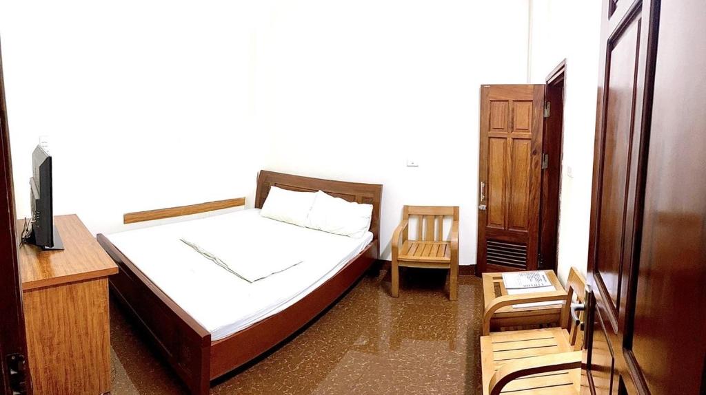 Postel nebo postele na pokoji v ubytování Nam Khánh Motel