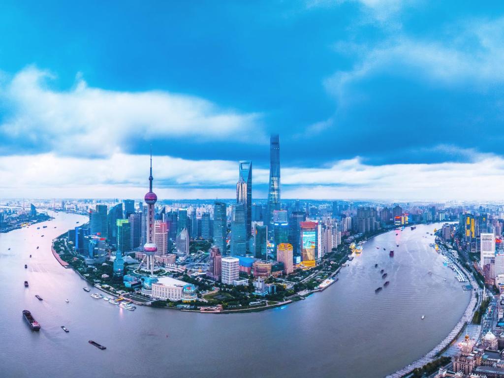 an aerial view of a city with a river at Pudong Shangri-La, Shanghai in Shanghai