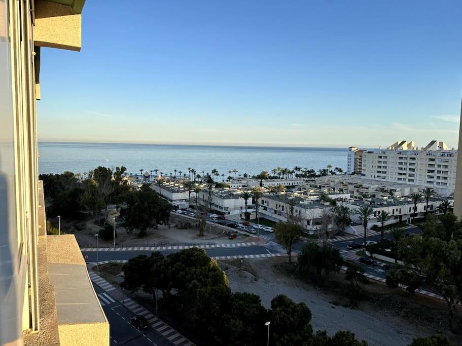 a view of a city and the ocean from a building at IRIVI 9 Apartment in Aguadulce