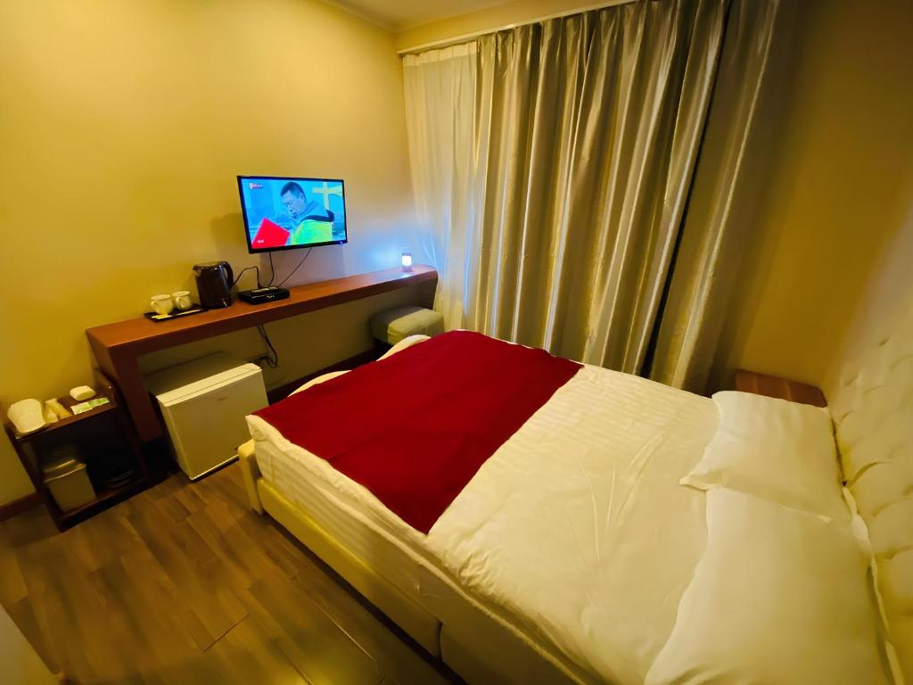 Katil atau katil-katil dalam bilik di Namar Hotel