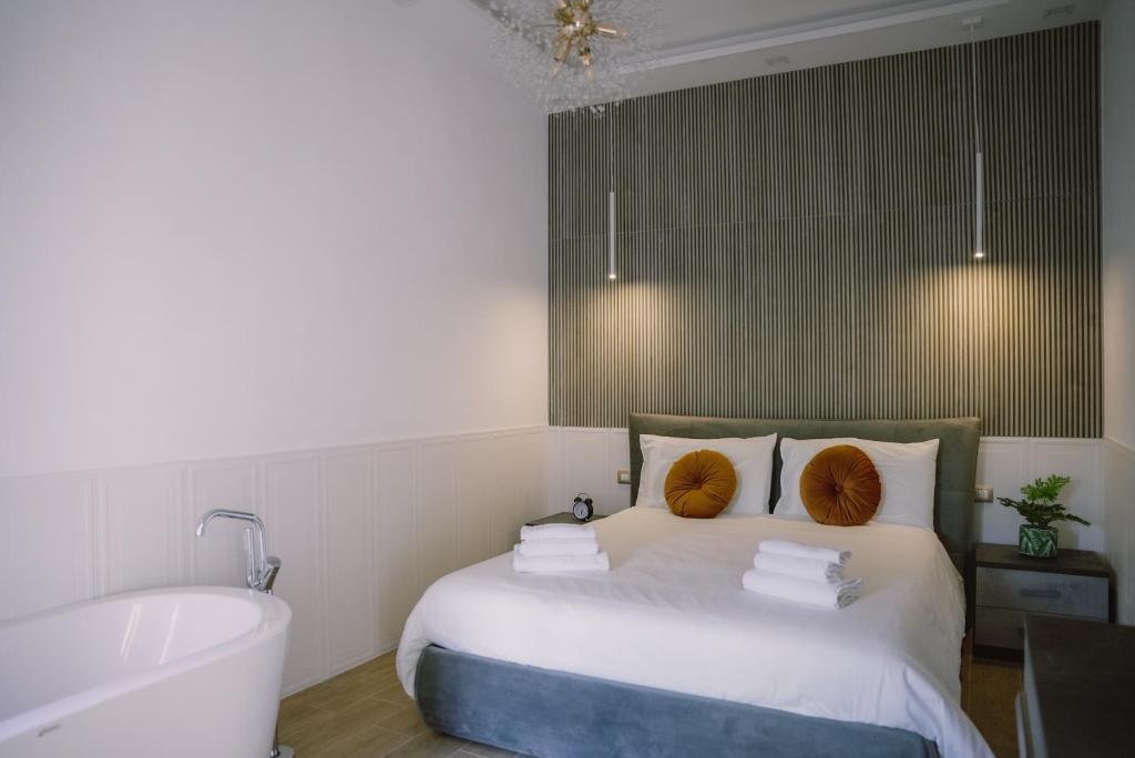 מיטה או מיטות בחדר ב-ILIONEO DELUXE