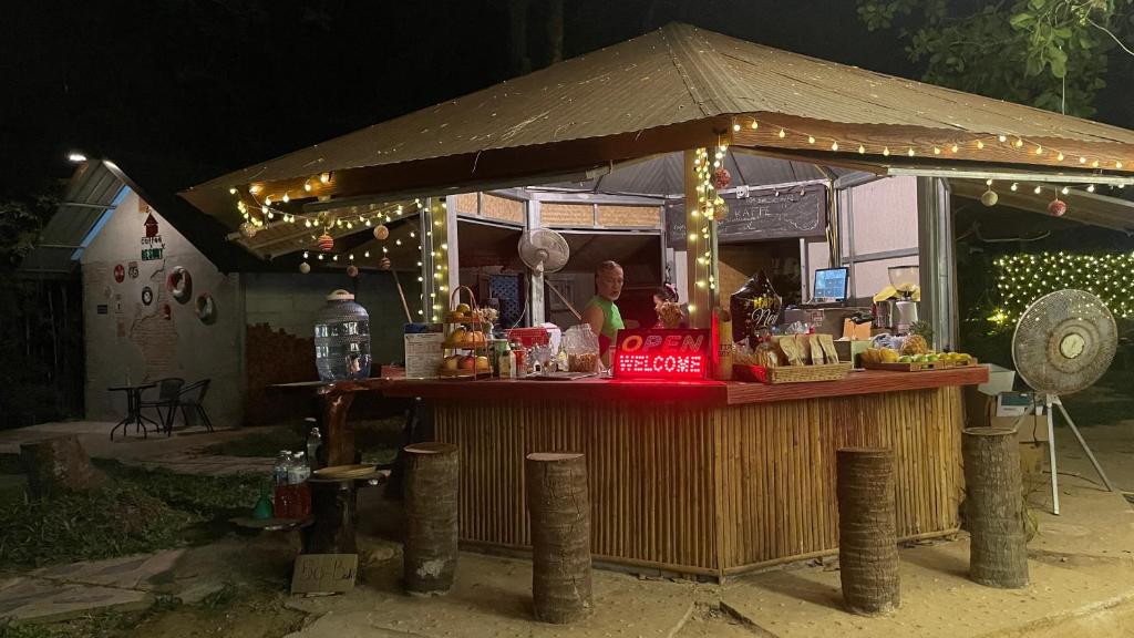 a food stand with lights on top of it at Coffee and Resort in Ko Phayam