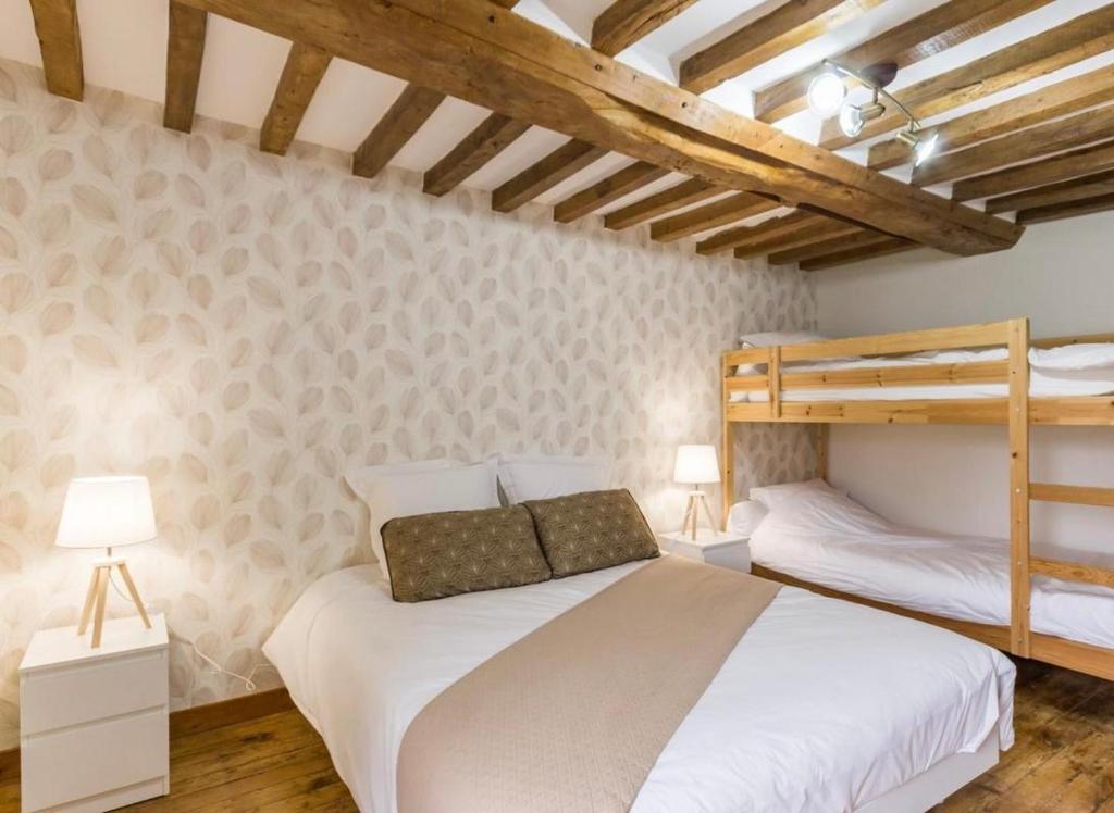 Postel nebo postele na pokoji v ubytování L'Îlot Pomme Cottage