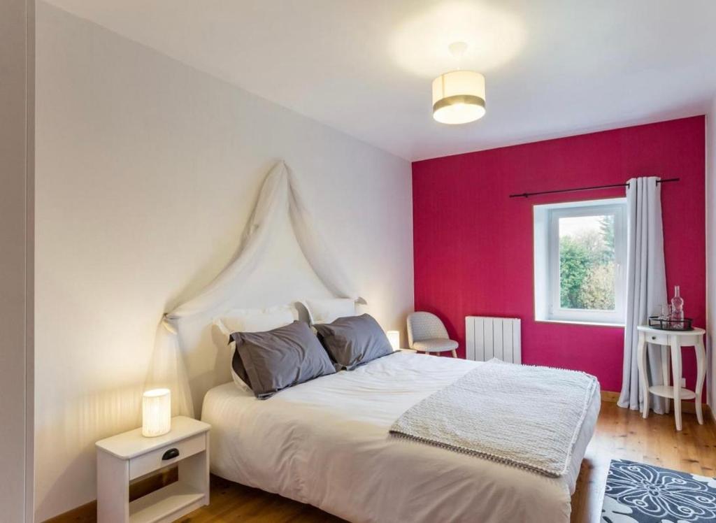 Postel nebo postele na pokoji v ubytování L'Îlot Pomme Cottage