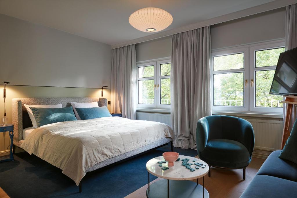 Postel nebo postele na pokoji v ubytování stilwerk Hotel Heimhude