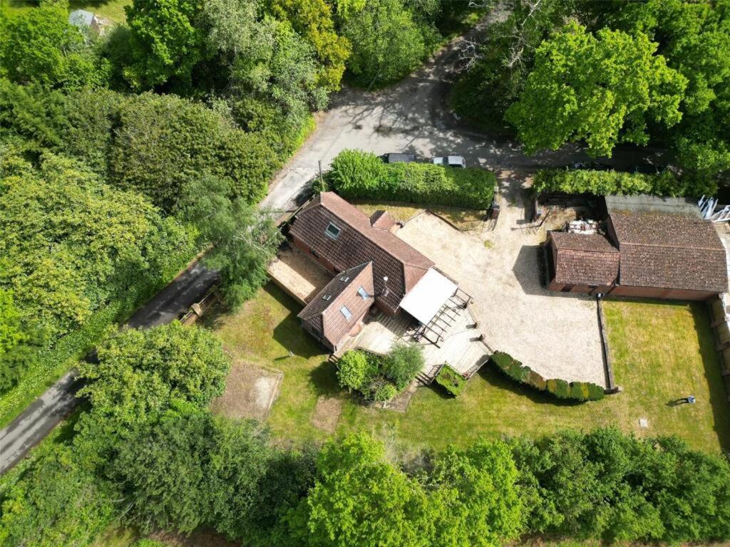 an overhead view of an old house in the woods at Paultons Golf Lodge in Ower