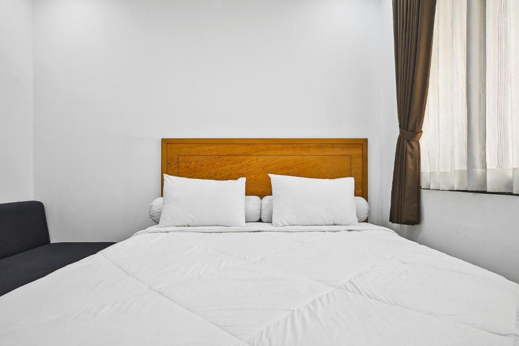 Postel nebo postele na pokoji v ubytování Bangreng Inn Hotel