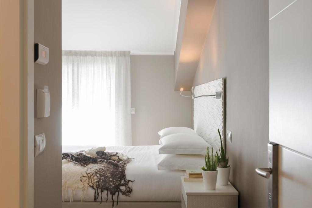 Postel nebo postele na pokoji v ubytování Albergo La Pace