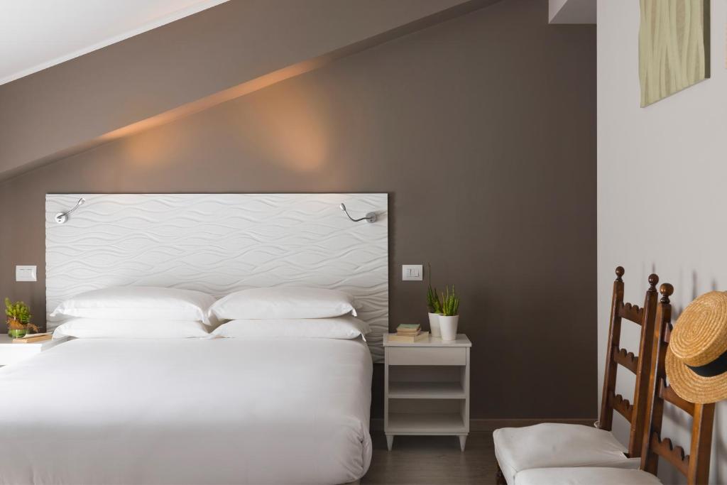 Postel nebo postele na pokoji v ubytování Albergo La Pace